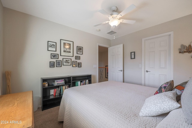 carpeted bedroom featuring a closet and ceiling fan