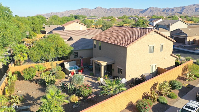 birds eye view of property featuring a mountain view