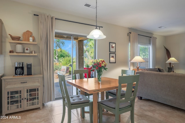 dining area with light tile patterned floors