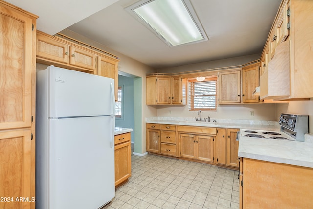 kitchen featuring white appliances and sink