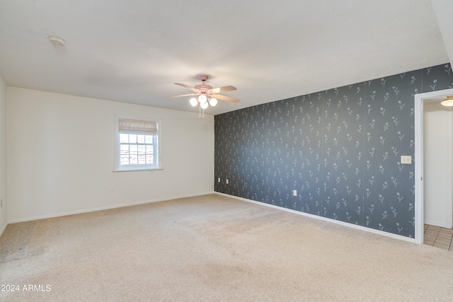 carpeted empty room with ceiling fan