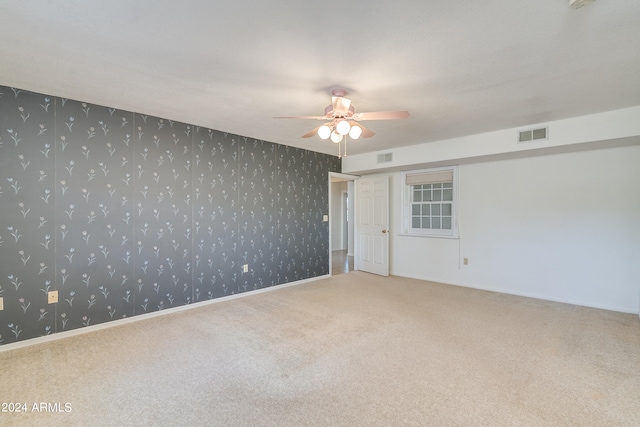 carpeted empty room with ceiling fan