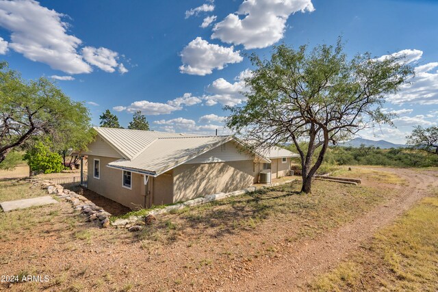 view of home's exterior featuring a mountain view