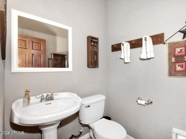 bathroom featuring toilet and tile patterned floors