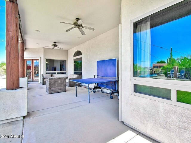 view of patio featuring outdoor lounge area, ceiling fan, and french doors