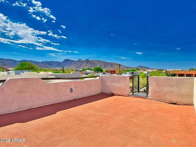 view of patio / terrace featuring a mountain view