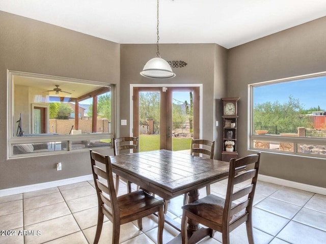 dining area featuring light tile patterned floors, french doors, and ceiling fan