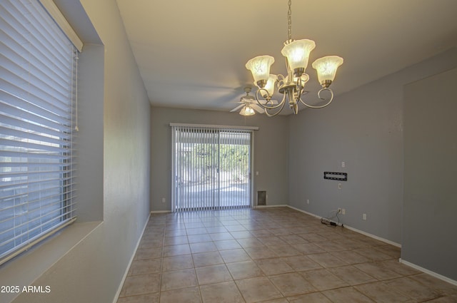 4714 E Paso Trl, Phoenix, AZ 85050 - unfurnished room with a chandelier, light tile patterned floors, and baseboards