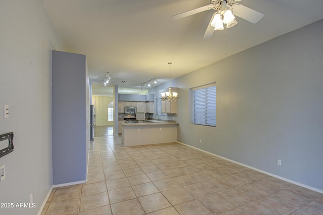 4714 E Paso Trl, Phoenix, AZ 85050 - kitchen featuring a peninsula, appliances with stainless steel finishes, pendant lighting, ceiling fan with notable chandelier, and open floor plan