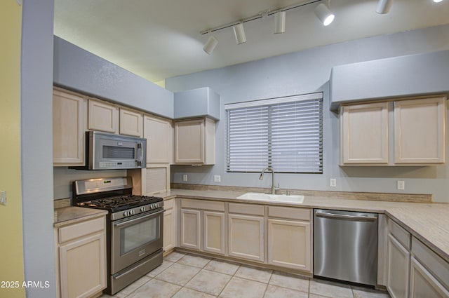 4714 E Paso Trl, Phoenix, AZ 85050 - kitchen featuring light brown cabinets, light tile patterned flooring, a sink, light countertops, and appliances with stainless steel finishes