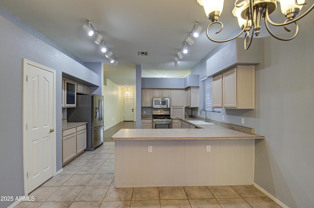 4714 E Paso Trl, Phoenix, AZ 85050 - kitchen with visible vents, a peninsula, light tile patterned flooring, a sink, and appliances with stainless steel finishes