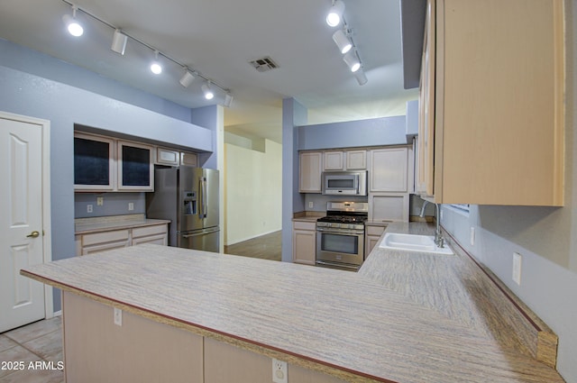 4714 E Paso Trl, Phoenix, AZ 85050 - kitchen featuring visible vents, track lighting, a sink, appliances with stainless steel finishes, and a peninsula