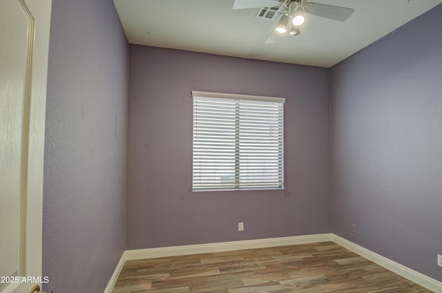 4714 E Paso Trl, Phoenix, AZ 85050 - empty room featuring visible vents, wood finished floors, baseboards, and ceiling fan