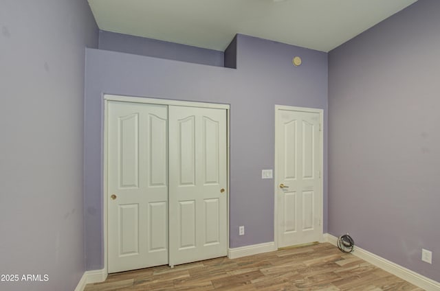4714 E Paso Trl, Phoenix, AZ 85050 - unfurnished bedroom with light wood-type flooring, baseboards, and a closet