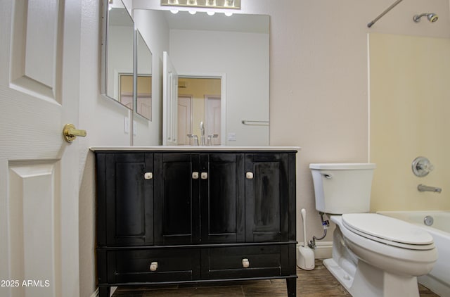4714 E Paso Trl, Phoenix, AZ 85050 - bathroom with vanity, toilet, wood finished floors, and  shower combination