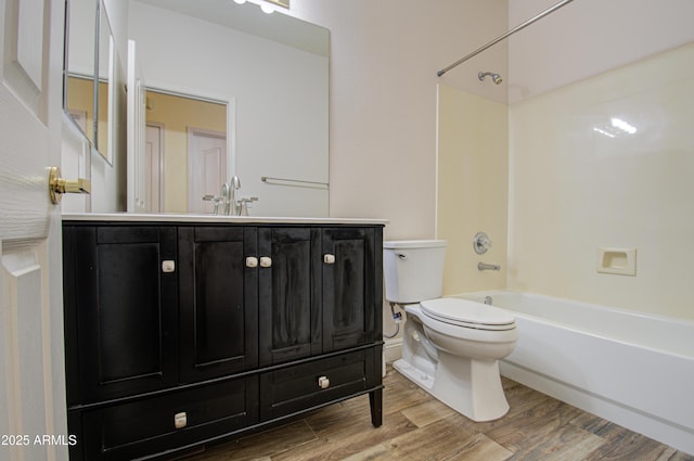 4714 E Paso Trl, Phoenix, AZ 85050 - bathroom featuring toilet, wood finished floors, vanity, and shower / tub combination