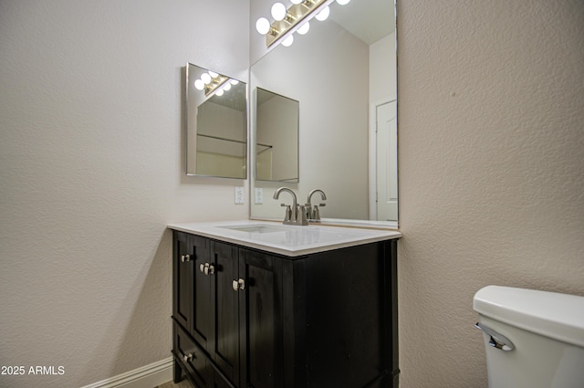 4714 E Paso Trl, Phoenix, AZ 85050 - bathroom featuring toilet, vanity, and a textured wall