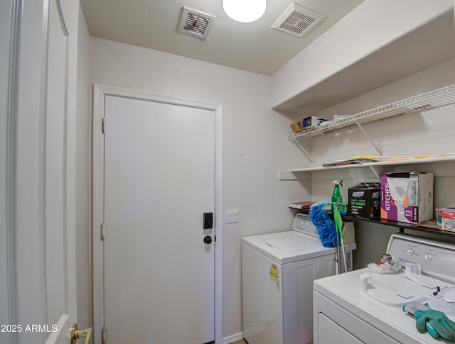 4714 E Paso Trl, Phoenix, AZ 85050 - laundry room with visible vents, laundry area, and washing machine and clothes dryer