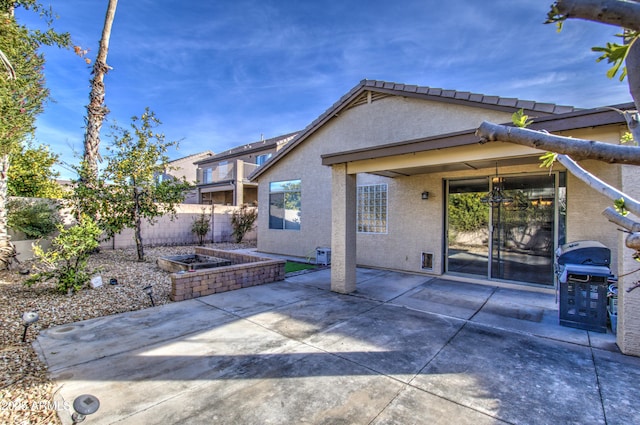4714 E Paso Trl, Phoenix, AZ 85050 - back of property with stucco siding, a patio, and fence