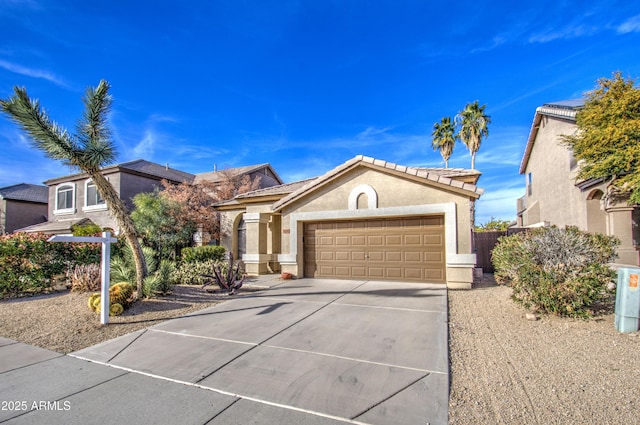 4714 E Paso Trl, Phoenix, AZ 85050 - mediterranean / spanish-style house with stucco siding, a tile roof, fence, concrete driveway, and an attached garage