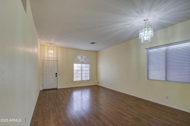 4714 E Paso Trl, Phoenix, AZ 85050 - interior space with baseboards, an inviting chandelier, and wood finished floors