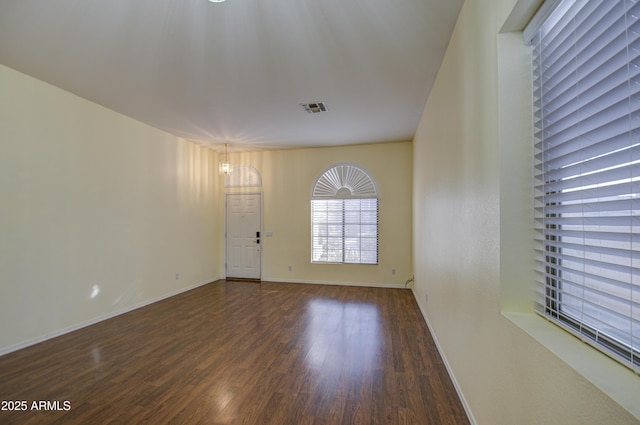 4714 E Paso Trl, Phoenix, AZ 85050 - interior space with visible vents, baseboards, and wood finished floors