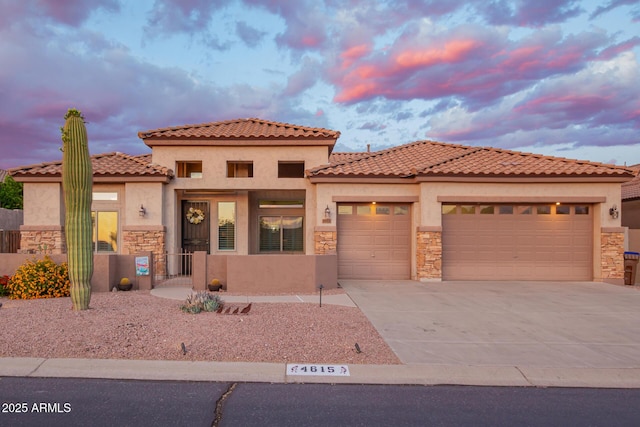 4615 S Primrose Dr, Gold Canyon, AZ 85118 - mediterranean / spanish home with a tiled roof, driveway, a garage, stone siding, and stucco siding