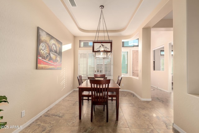 4615 S Primrose Dr, Gold Canyon, AZ 85118 - dining area featuring baseboards, visible vents, plenty of natural light, and a raised ceiling