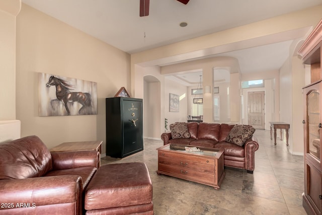 4615 S Primrose Dr, Gold Canyon, AZ 85118 - living room featuring a ceiling fan, arched walkways, and baseboards