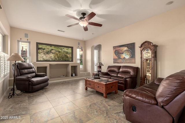 4615 S Primrose Dr, Gold Canyon, AZ 85118 - living area featuring arched walkways, ceiling fan, baseboards, and visible vents