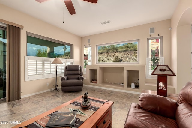 4615 S Primrose Dr, Gold Canyon, AZ 85118 - living area featuring visible vents, arched walkways, plenty of natural light, and ceiling fan