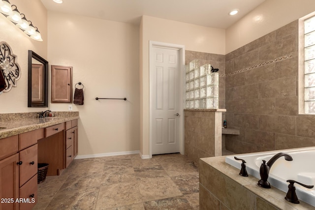 4615 S Primrose Dr, Gold Canyon, AZ 85118 - full bathroom featuring double vanity, a garden tub, stone finish flooring, baseboards, and a walk in shower