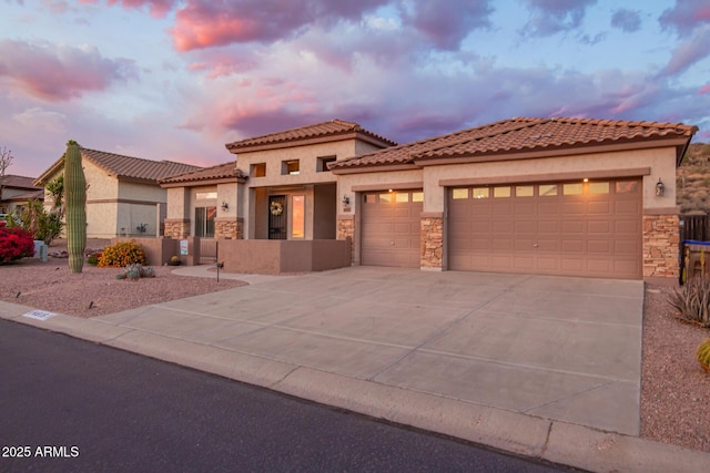 4615 S Primrose Dr, Gold Canyon, AZ 85118 - view of front of property featuring a tile roof, stone siding, a garage, stucco siding, and concrete driveway