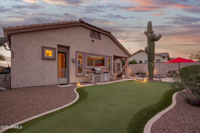 4615 S Primrose Dr, Gold Canyon, AZ 85118 - rear view of house with fence, a patio area, and stucco siding