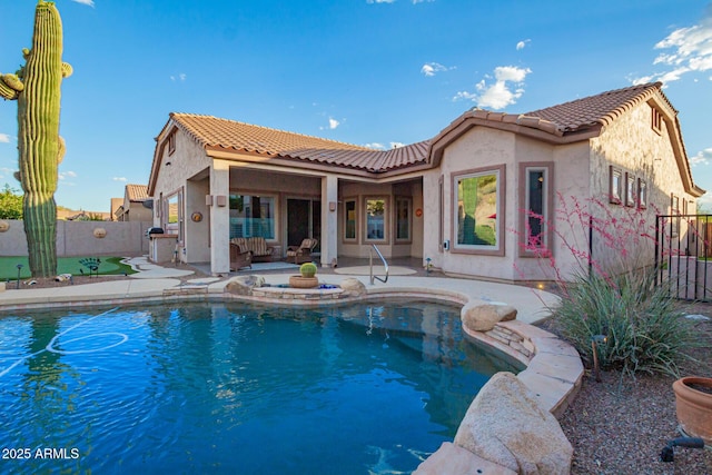 4615 S Primrose Dr, Gold Canyon, AZ 85118 - back of property featuring a fenced backyard, stucco siding, and a tiled roof