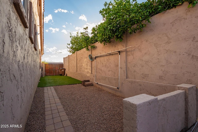 4615 S Primrose Dr, Gold Canyon, AZ 85118 - view of home's exterior with a fenced backyard, stucco siding, and a yard