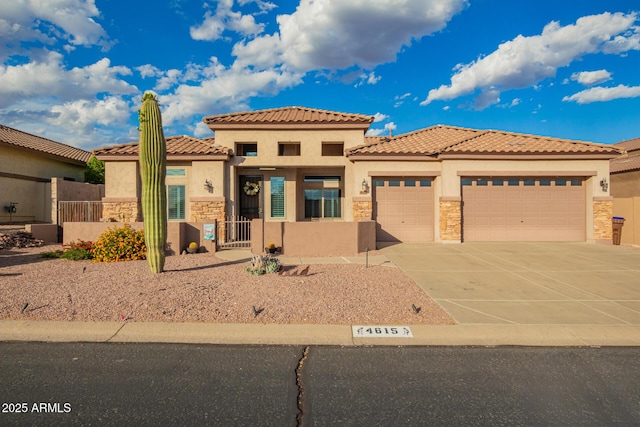 4615 S Primrose Dr, Gold Canyon, AZ 85118 - view of front facade with an attached garage, stucco siding, and stone siding