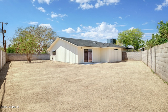 back of house with cooling unit and a patio