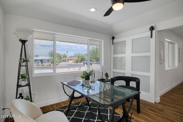 dining area with dark hardwood / wood-style floors and ceiling fan