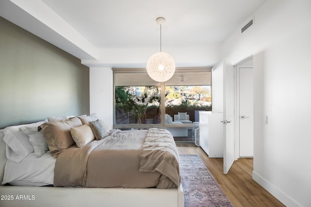 bedroom featuring light wood-type flooring