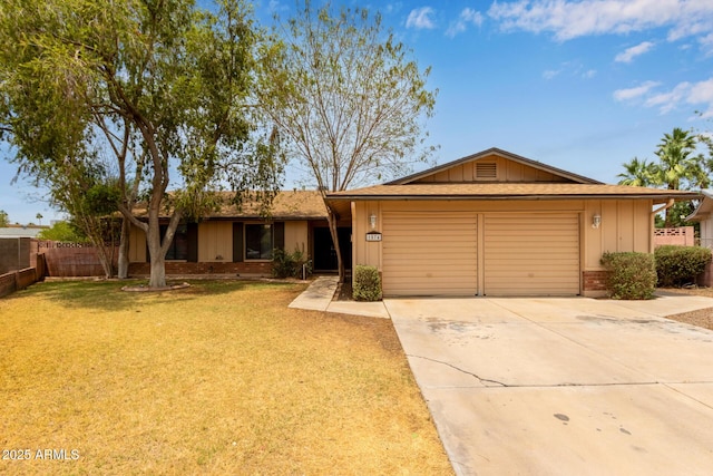 1874 E Huntington Dr, Tempe, AZ 85282 - single story home featuring an attached garage, driveway, brick siding, and board and batten siding