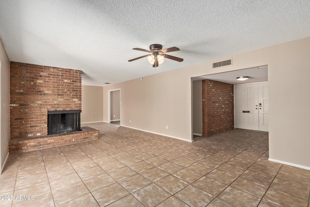 1874 E Huntington Dr, Tempe, AZ 85282 - unfurnished living room featuring ceiling fan, a brick fireplace, a textured ceiling, light tile patterned flooring, and baseboards