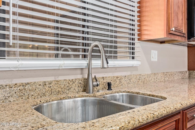 1874 E Huntington Dr, Tempe, AZ 85282 - kitchen view of a sink, light stone countertops, and brown cabinets