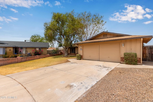1874 E Huntington Dr, Tempe, AZ 85282 - ranch-style house featuring board and batten siding, driveway, and an attached garage