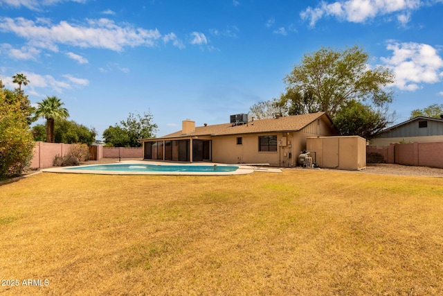 1874 E Huntington Dr, Tempe, AZ 85282 - rear view of house featuring a sunroom, a chimney, and central AC unit