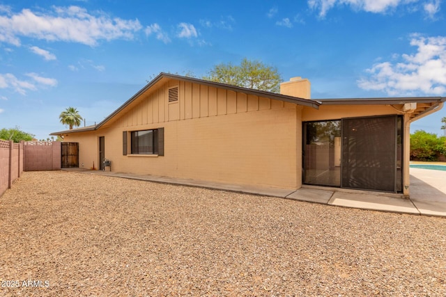 1874 E Huntington Dr, Tempe, AZ 85282 - rear view of house with a chimney, a fenced backyard, a patio, and brick siding