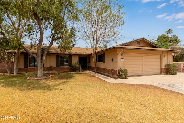 1874 E Huntington Dr, Tempe, AZ 85282 - ranch-style house featuring board and batten siding, a garage, driveway, brick siding, and a front lawn