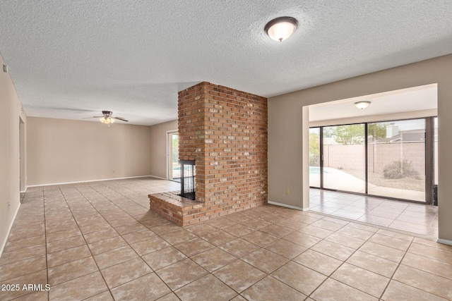 1874 E Huntington Dr, Tempe, AZ 85282 - unfurnished living room featuring light tile patterned floors, a ceiling fan, a textured ceiling, and a fireplace