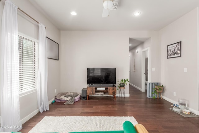 living area featuring a ceiling fan, recessed lighting, wood finished floors, and baseboards