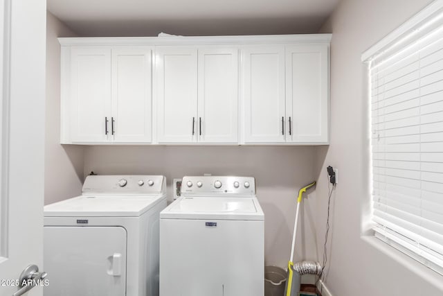 laundry area with cabinet space and independent washer and dryer